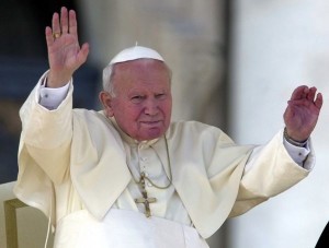 Pope John Paul II greats the faithfull as he arrives  for an audience to the Rome's Bank employee and to the Messina, Turin and Trento dioceses in St. Peter's Square at the Vatican,  Saturday November 11, 2000. This weekend marks the Vatican's Holy Year celebrations for the world of agricolture. (AP Photo/Marco Di Lauro)